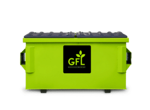 2 Yard Green GFL Dumpster with a man standing next to it