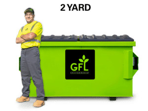 2 Yard Green GFL Dumpster with a man standing next to it