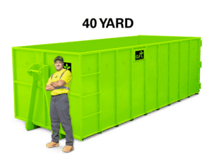 A man stands in front of a green 40 yard GFL roll off dumpster