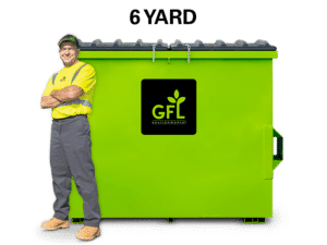 6 Yard Green GFL Dumpster with a man standing next to it