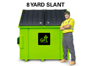8 Yard Slant Top Green GFL Dumpster with a man standing next to it