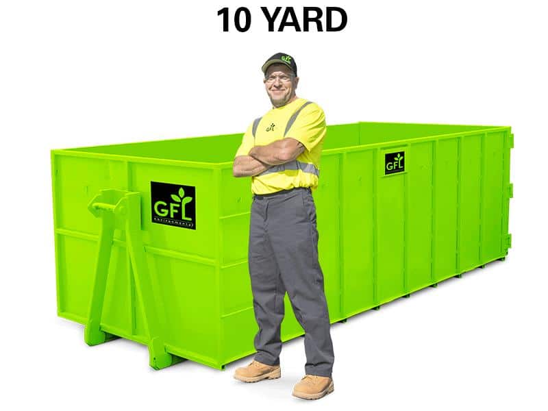 A man stands in front of a green 10 yard GFL roll off dumpster